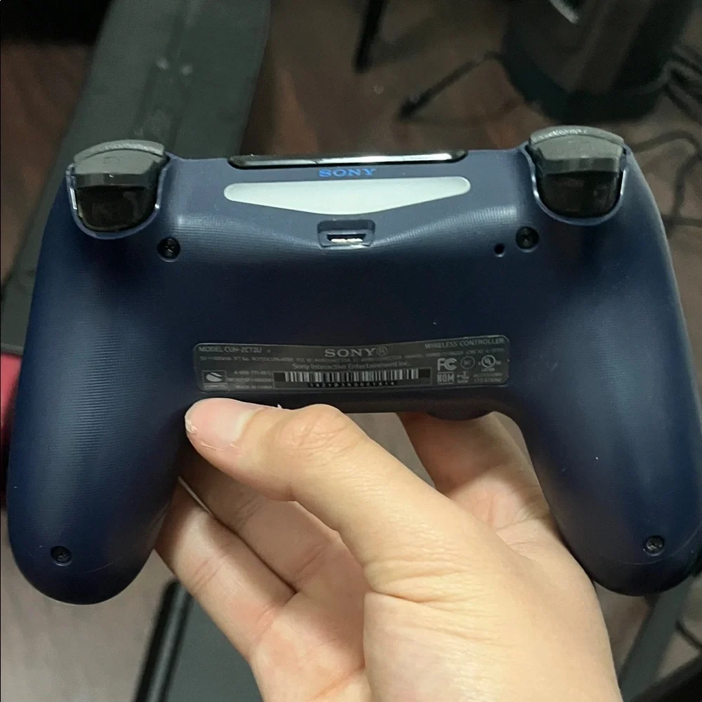 Sony PlayStation 4 Console with Black and Blue Controllers
